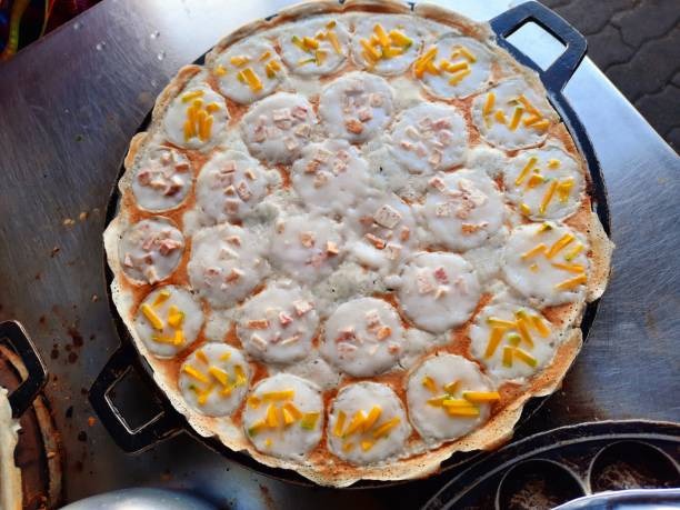Cast Iron Pan Used to Cook Traditional Coconut Rice Pancakes